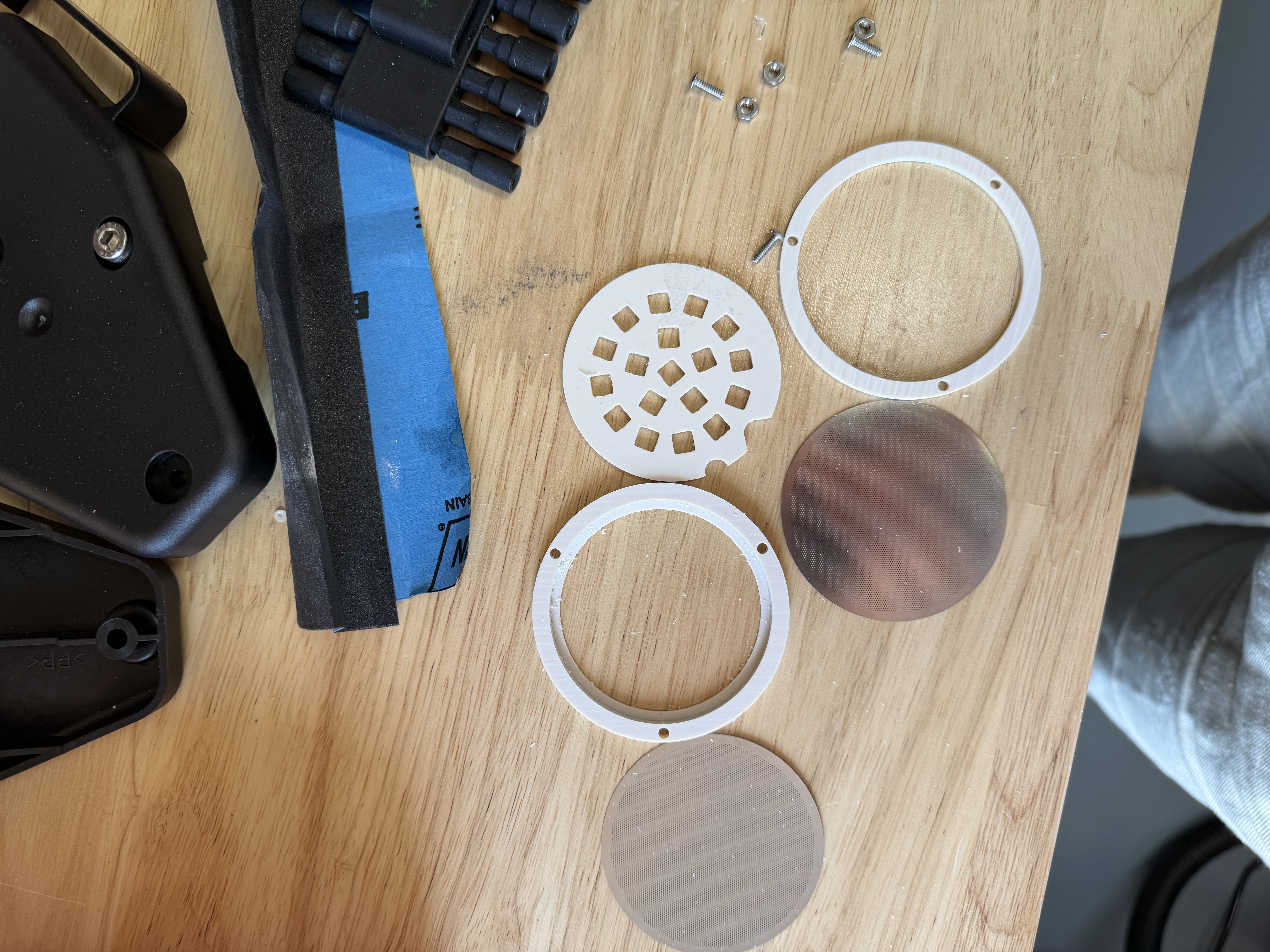 Scaffold holder components laid out before assembly